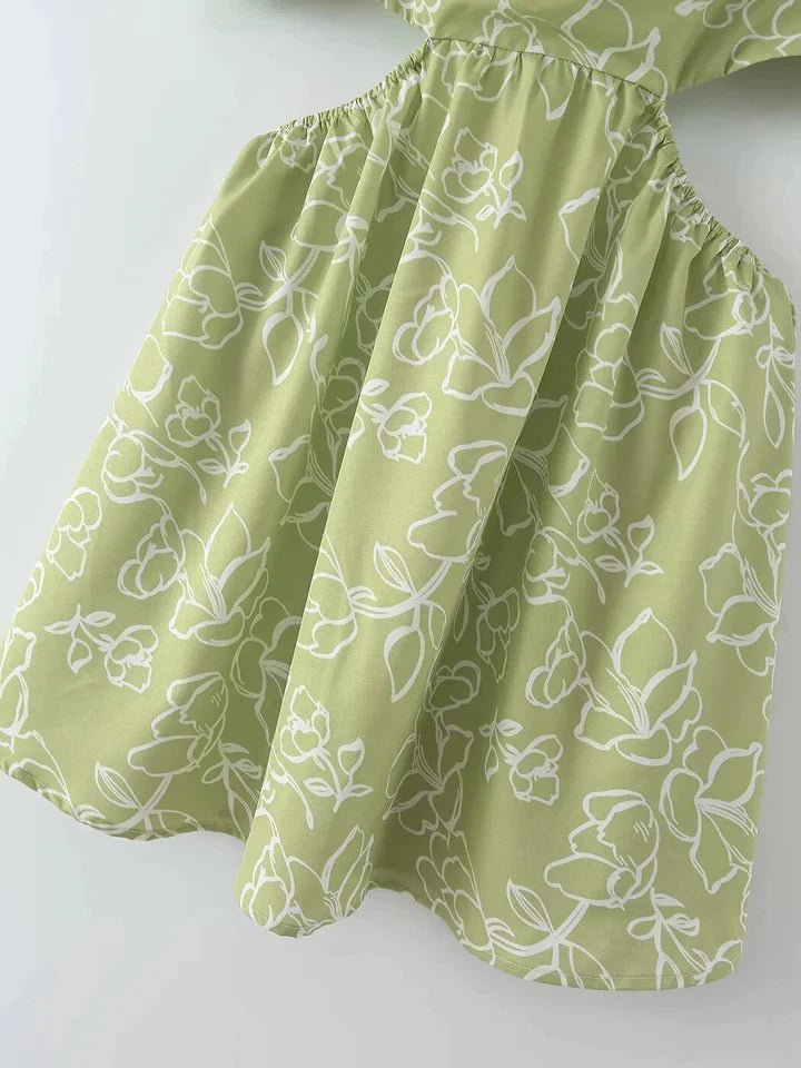 Madalynn | DAMESJURK MET UITGEHOLDE ZIJDES EN BLOEMENPRINT