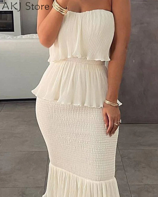 Fiona | DAMES BANDEAU JURK MET GERIMPELDE RUCHE ZOOM EN LAAGJES