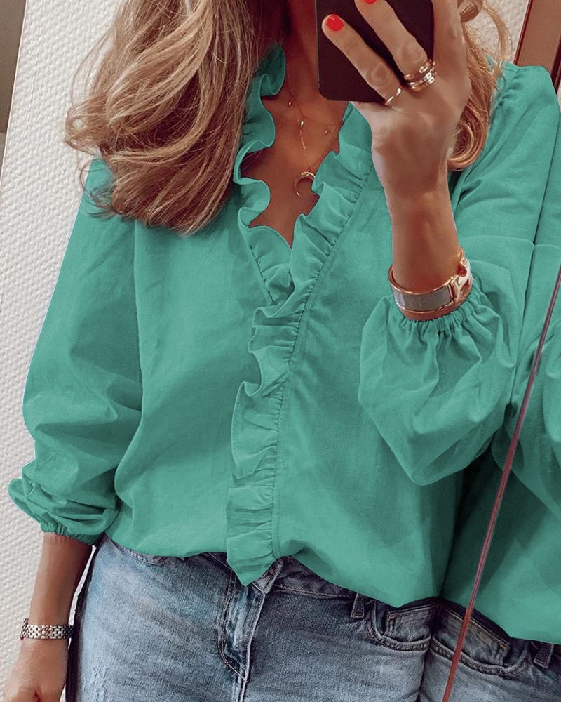 Blouse unie à manches bouffantes