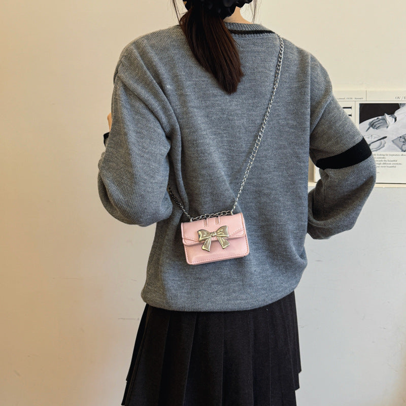 Damen Mini-Handtasche mit schimmerndem Schleifenverschluss