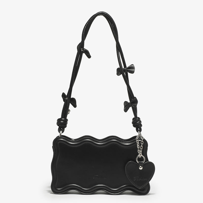Damen Mini-Handtasche mit kreativem Wellenmuster und verspieltem Anhänger