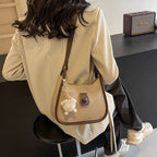 Damen Schultertasche aus hochwertigem Kunstleder mit verspieltem Charme