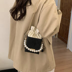 Damen stilvolle Mini-Handtasche mit Kordelzug und Perlenakzent