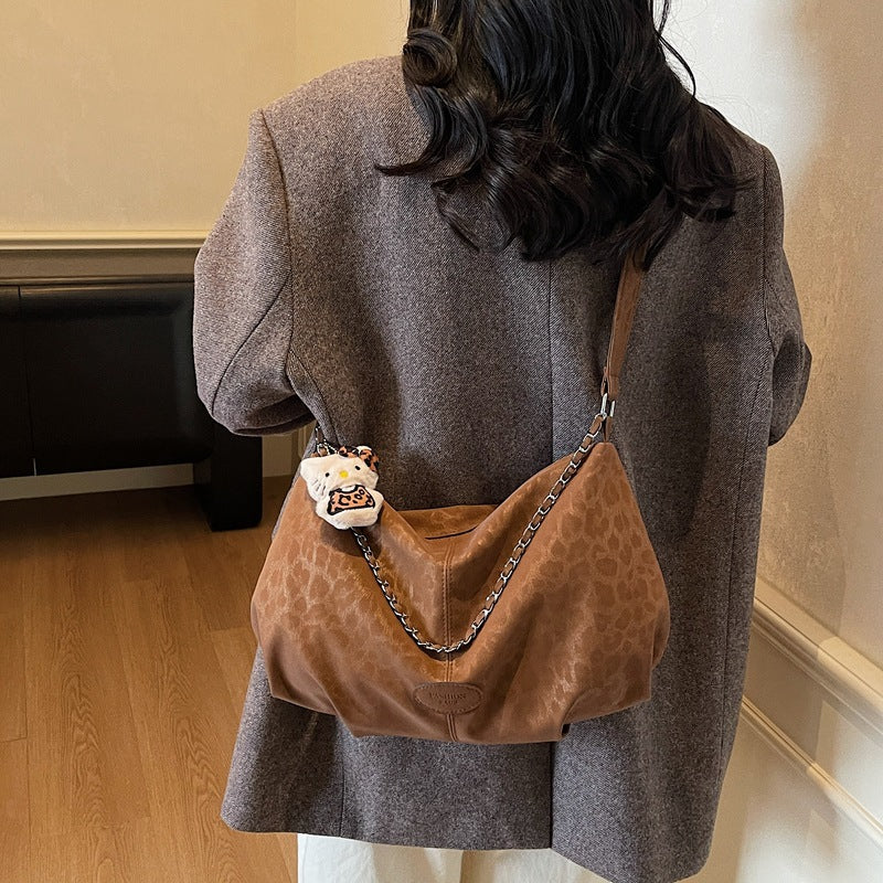 Damen elegante Hobo-Tasche aus strukturiertem Kunstleder mit abnehmbarem Anhänger