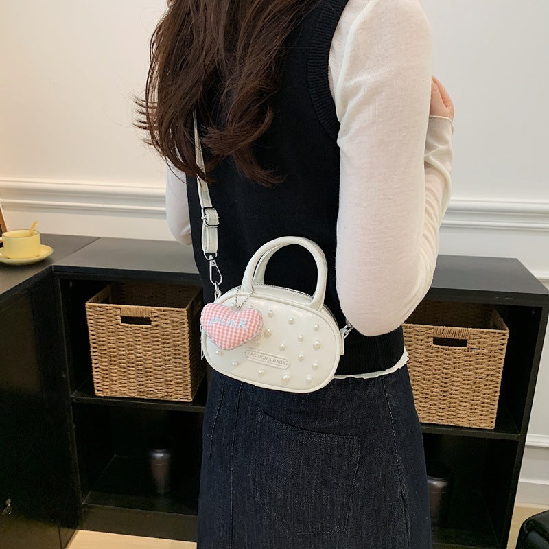 Damen trendige Mini-Handtasche mit auffälligen Perlenapplikationen