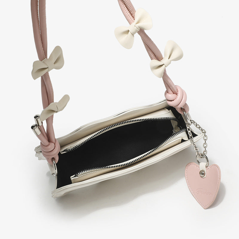 Damen Mini-Handtasche mit kreativem Wellenmuster und verspieltem Anhänger