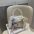 Damen Mini-Handtasche mit verspieltem Tiermotiv und charmantem Anhänger