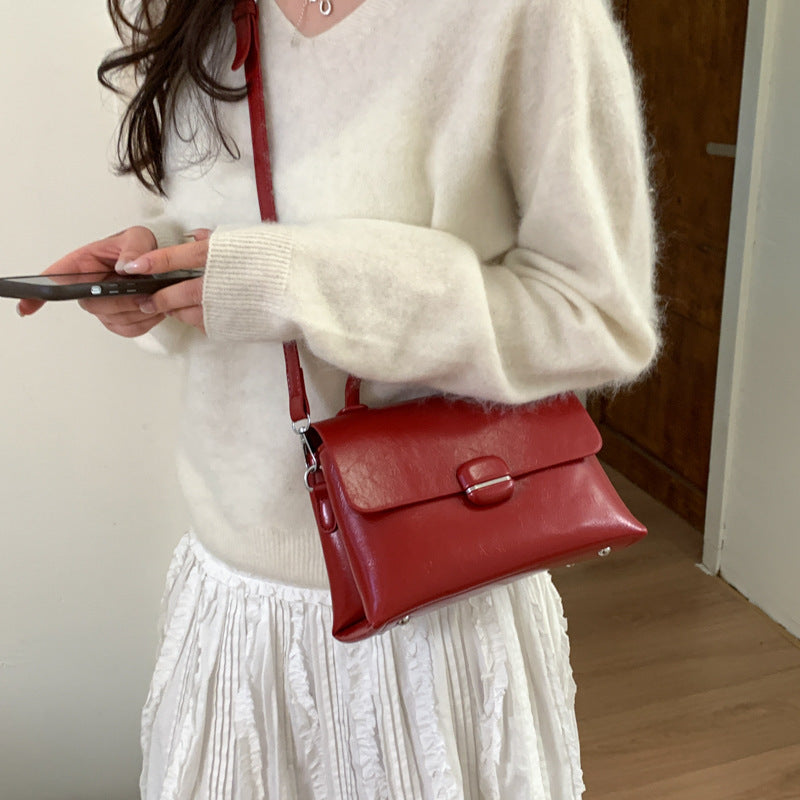 Damentasche mit strukturiertem Design und eleganter Verschluss