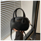 Modische Damenhandtasche mit eleganten Zuggriffen und abnehmbarem Schultergurt