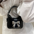 Damen Mini-Handtasche mit stylischem Schleifenverschluss