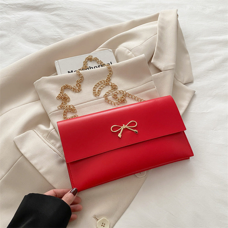 Damen elegante Clutch im minimalistischen Design mit goldenen Akzenten