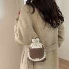 Damen stilvolle Mini-Handtasche mit Kordelzug und Perlenakzent