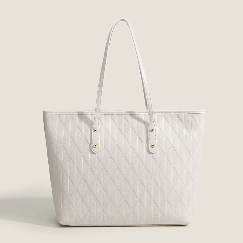 Damentasche mit elegantem Diamantdesign und praktischen Innenfächern