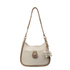 Damen Schultertasche aus hochwertigem Kunstleder mit verspieltem Charme