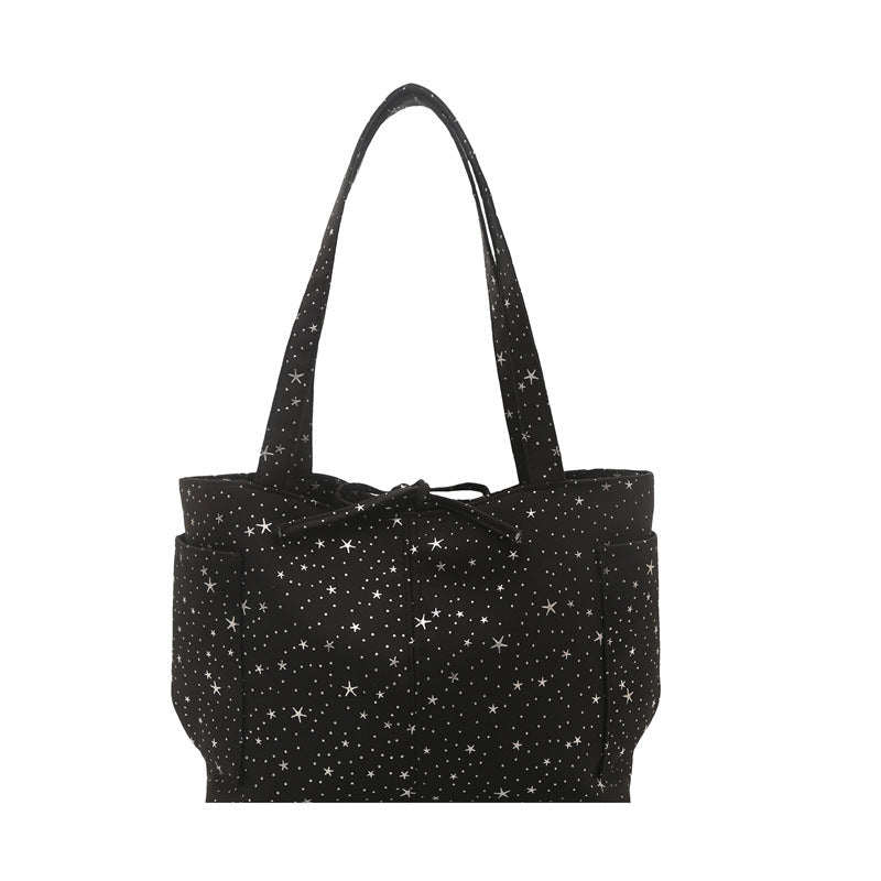 Damentasche mit glitzerndem Sternmuster
