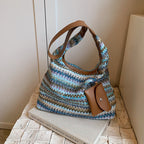 Farbenfrohe Schultertasche aus Baumwolle mit einer praktischen Zusatztasche