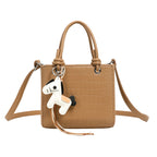 Damen Mini Tasche mit Tieranhänger und modernem Krokodileffekt