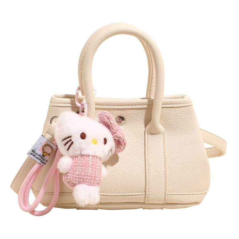 Damen Mini-Handtasche mit verspieltem Plüschanhänger