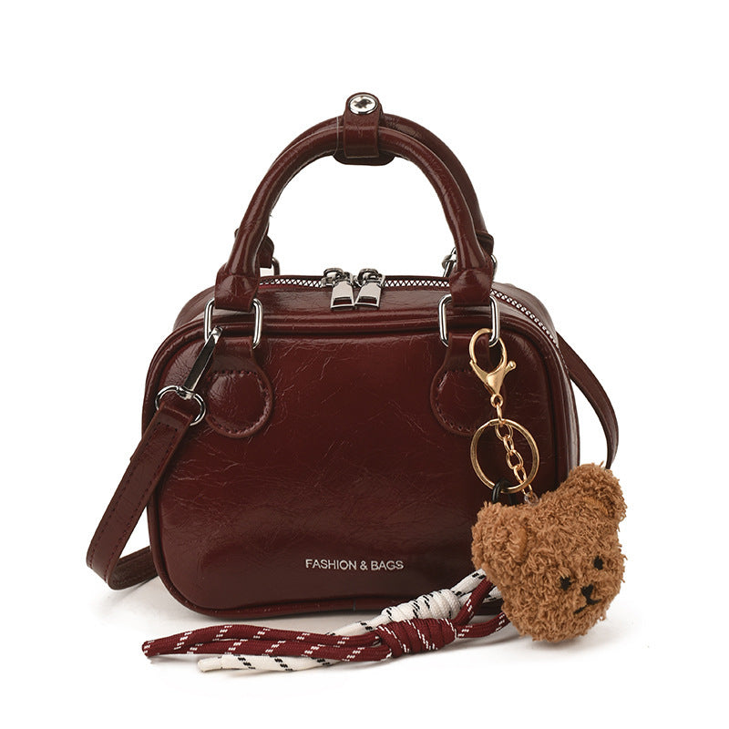 Damen Mini-Handtasche mit süßem Anhänger