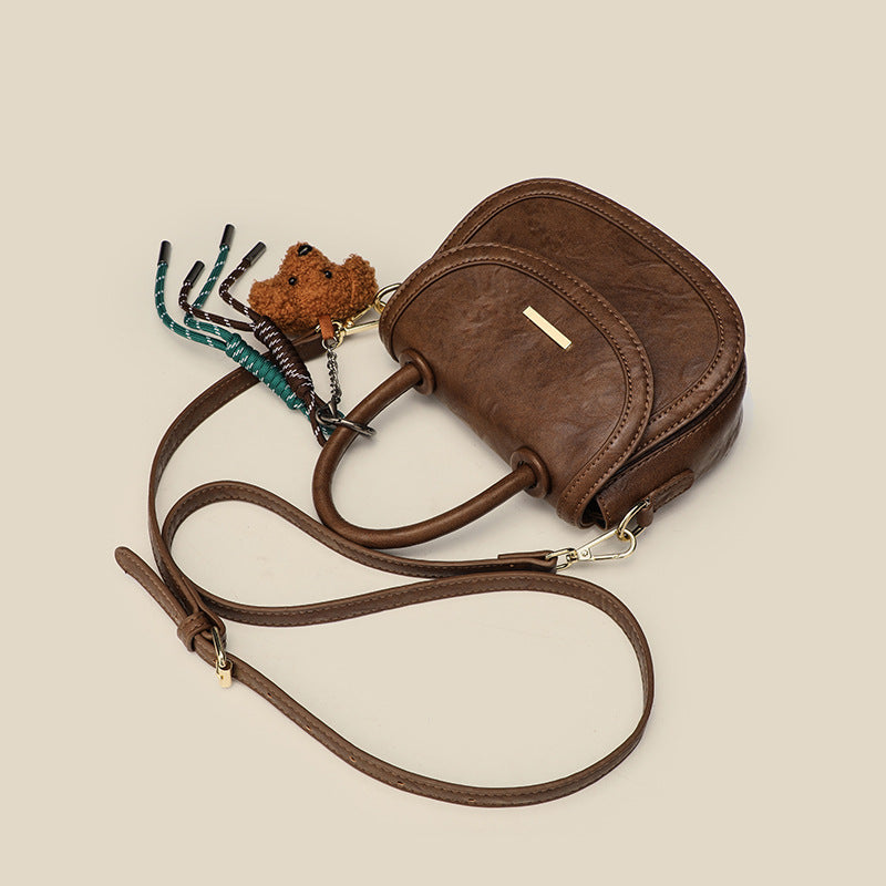 Damen Mini-Handtasche mit verspieltem Detail und hochwertigem Kunstleder