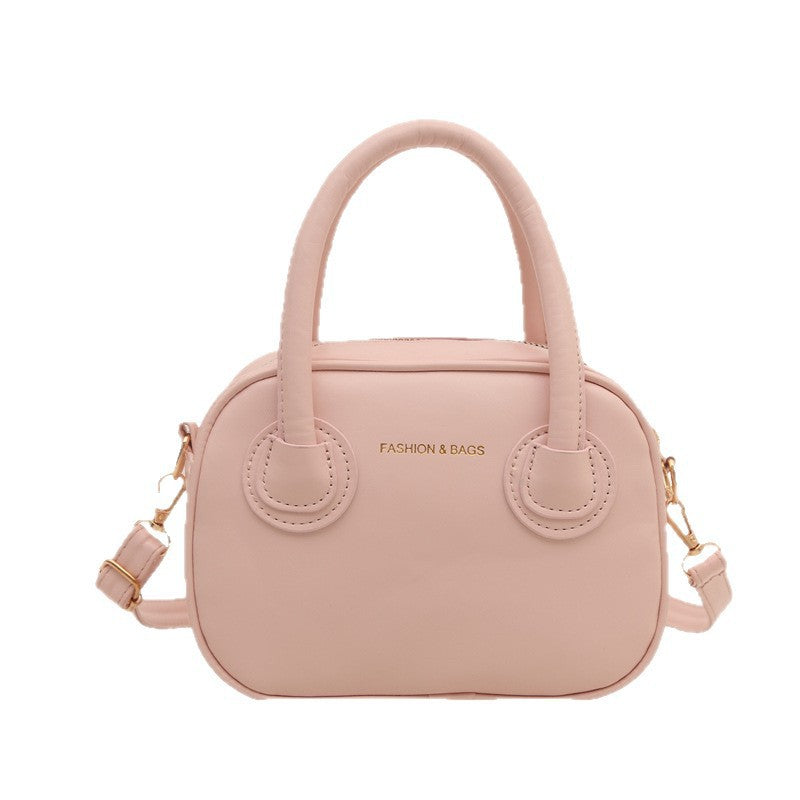 Modische Damenhandtasche mit eleganten Zuggriffen und abnehmbarem Schultergurt