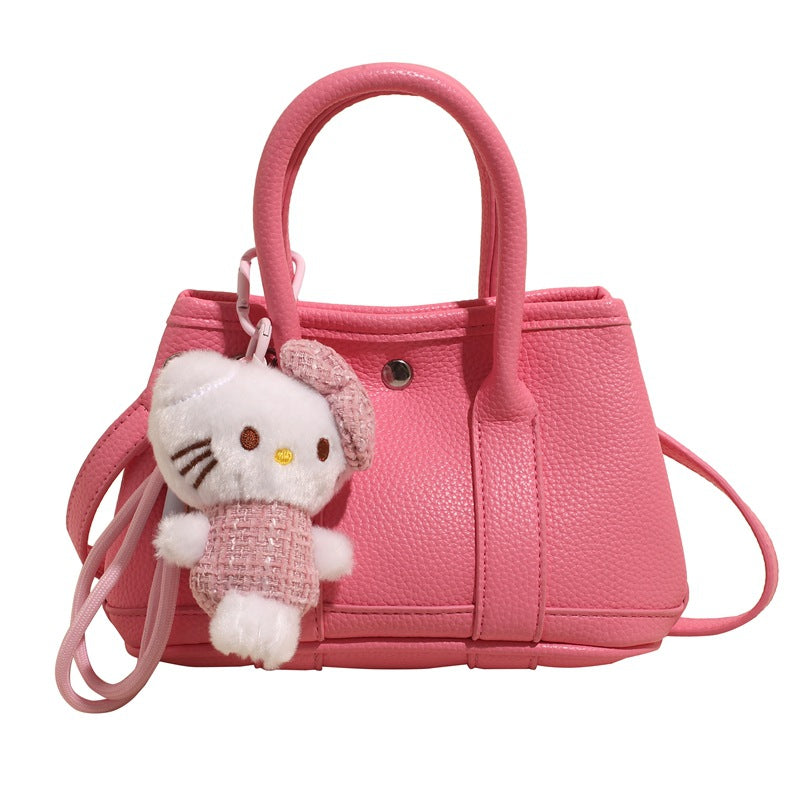 Damen Mini-Handtasche mit verspieltem Plüschanhänger