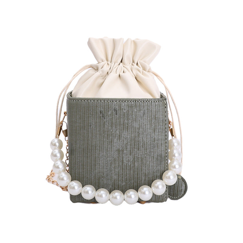 Damen stilvolle Mini-Handtasche mit Kordelzug und Perlenakzent