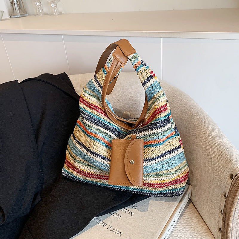 Farbenfrohe Schultertasche aus Baumwolle mit einer praktischen Zusatztasche