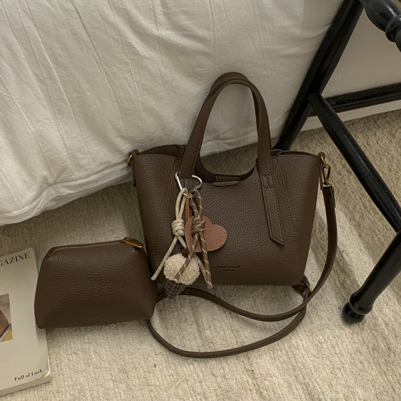 Damen Mini-Handtasche in elegantem Design mit charmantem Anhänger