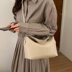 Damenhandtasche mit flexiblem Riemen und elegantem Design