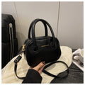 Modische Damenhandtasche mit eleganten Zuggriffen und abnehmbarem Schultergurt