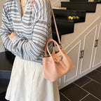 Damen Mini-Handtasche mit stylischem Druckknopfverschluss