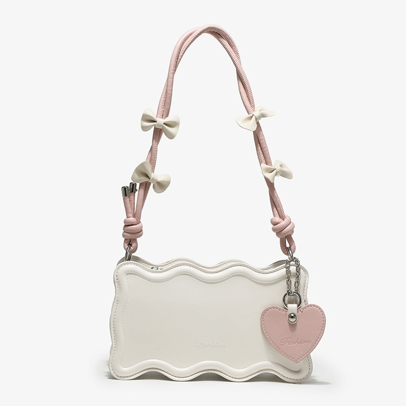 Damen Mini-Handtasche mit kreativem Wellenmuster und verspieltem Anhänger