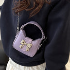 Damen Mini-Handtasche mit stylischem Schleifenverschluss