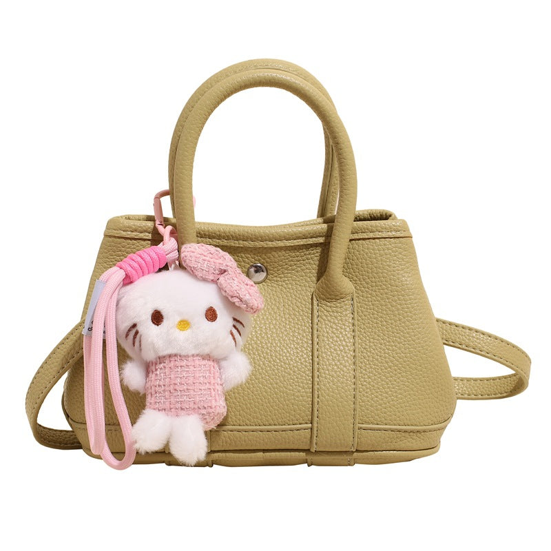 Damen Mini-Handtasche mit verspieltem Plüschanhänger