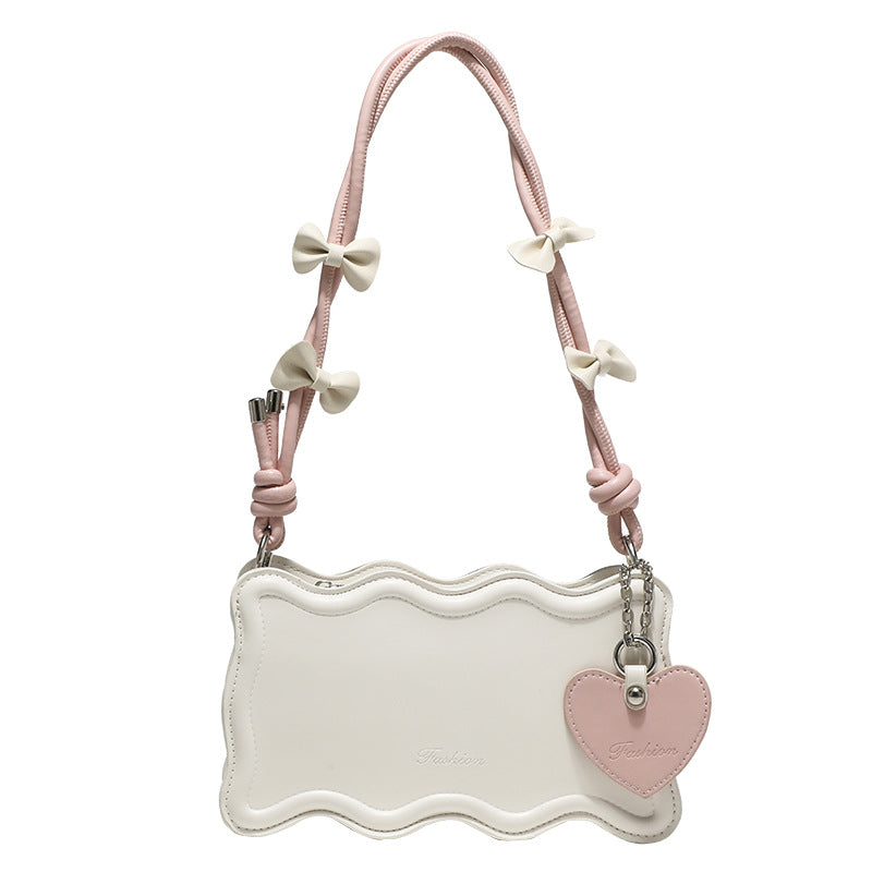 Damen Mini-Handtasche mit kreativem Wellenmuster und verspieltem Anhänger