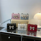 Damen Mini-Handtasche mit schimmerndem Schleifenverschluss