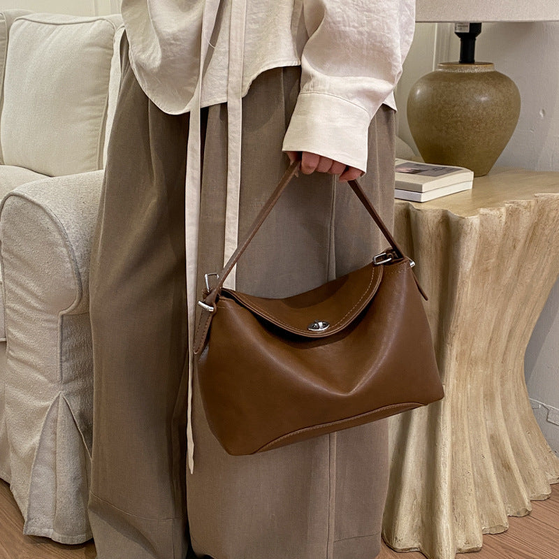 Damenhandtasche mit flexiblem Riemen und elegantem Design