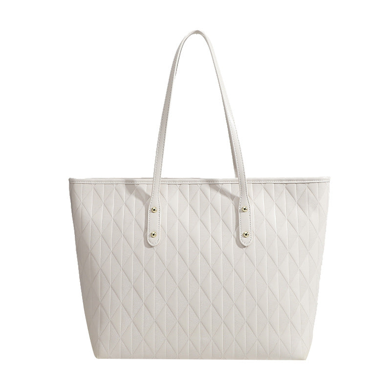 Damentasche mit elegantem Diamantdesign und praktischen Innenfächern