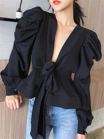 Blouse élégante à col en V et manches bouffantes