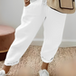 Pantalon uni avec cordon de serrage et poche oblique