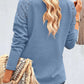 Elegante blouse met een spitsvormige kanten halslijn