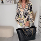 V-hals herfstblouse met kleurtjes