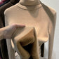 Eline | Elegante trui met vollemouwen en hogehals