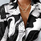 Stijlvolle zwart witte blouse