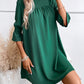 Elegante jurk met col in een effen kleur