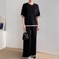 Haut à manches courtes avec col rond et pantalon assorti costume deux pièces