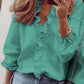 Blouse cripes à volants et col V